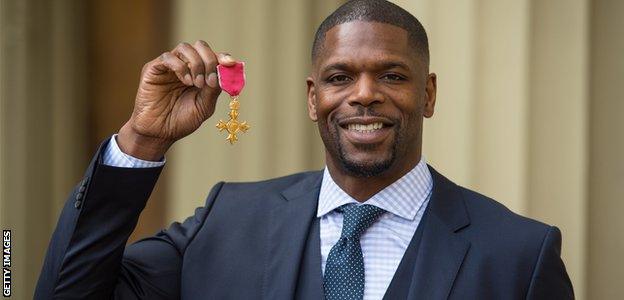 Mark Prince shows off his OBE