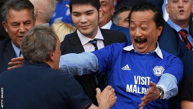 Cardiff owner Vincent Tan (right foreground) embraces manager Neil Warnock after the final whistle against Reading