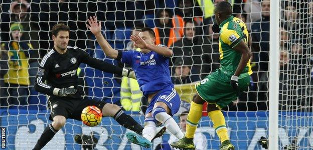 John Terry blocks Sebastien Bassong's shot