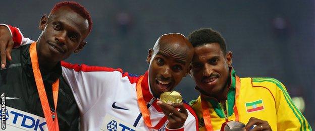 Mo Farah (centre) with his 5,000m gold medal at the 2015 World Championships