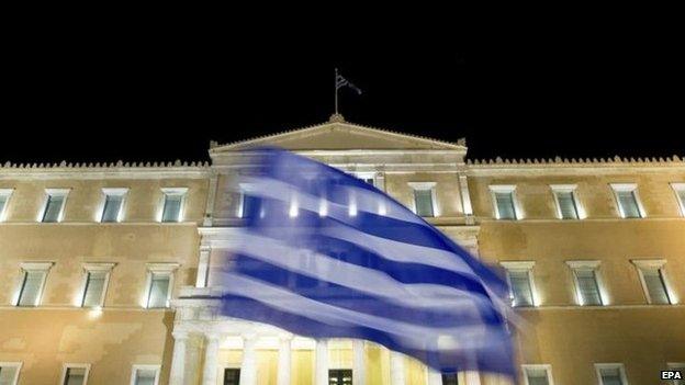 Supporters of the Syriza party and of the "No" vote campaign wave a national flags after results of the referendum, in front of Greek Parliament in Athens