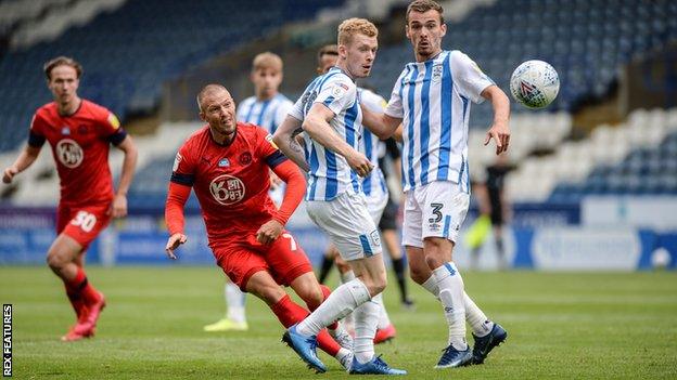 Anthony Pilkington scores for Wigan against Huddersfield