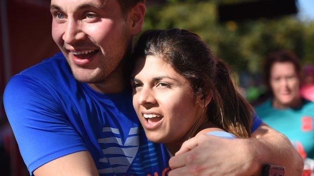 A delighted couple after finishing the Cardiff Half Marathon