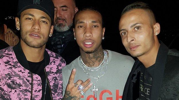 Neymar (left) with rapper Tyga (centre)