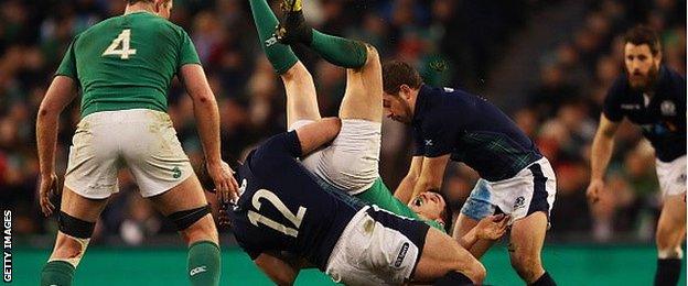 Scotland centre Alex Dunbar tackles Jonny Sexton