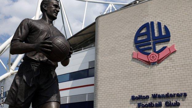 A general view of Bolton's Macron Stadium with the statue of Nat Lofthouse outside