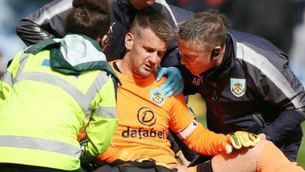 Tom Heaton receives treatment