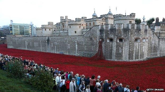 people queue to see poppies