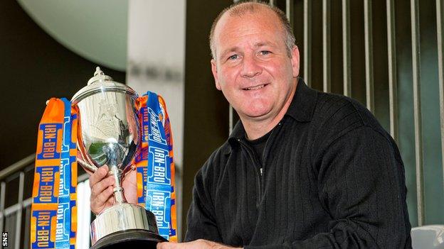 Queen's Park manager Gus MacPherson holds the Scottish Challenge Cup