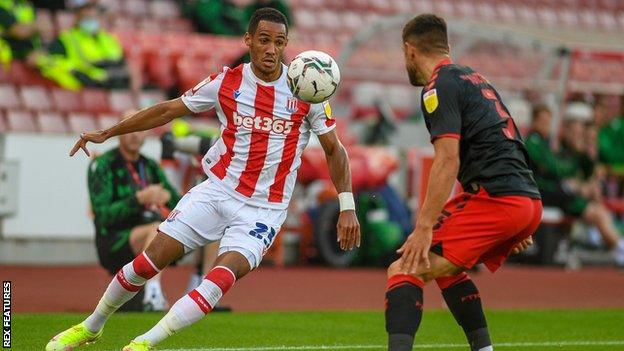 Tom Ince (left) in action for Stoke City against Fleetwood Town