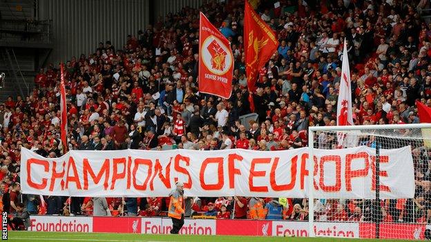 Banners held by Liverpool fans on the Kop before their team's game against Norwich