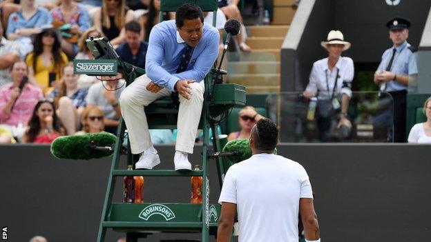 Nick Kyrgios speaks with the umpire at Wimbledom