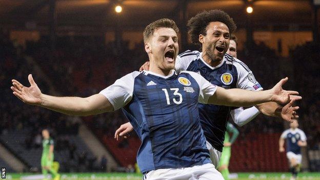 Chris Martin celebrates scoring for Scotland against Slovenia