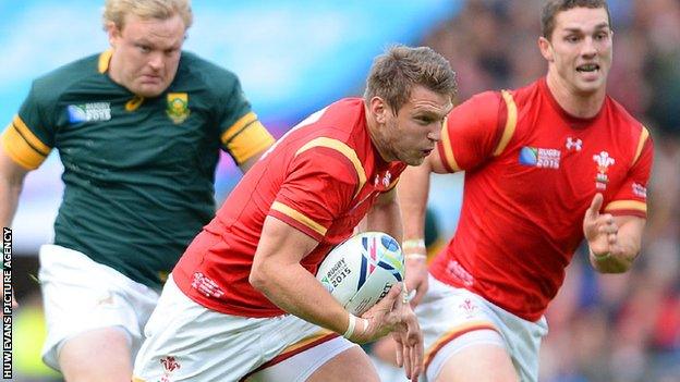 Dan Biggar makes a break for Wales against South Africa