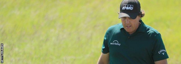 Phil Mickelson of the United States walks on the 18th green during the third round of the 2018 U.S. Open at Shinnecock Hills Golf Club on June 16, 2018 in Southampton, New York.