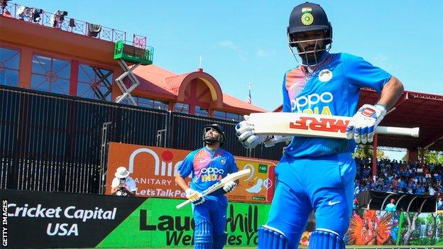 Shikhar Dhawan and Rohit Sharma walk out to open the batting for India against West Indies in Florida in August 2019