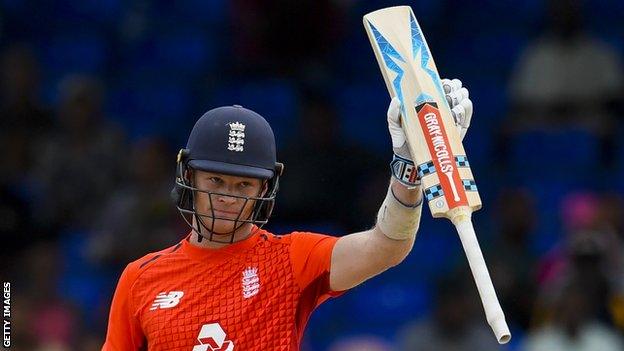 England batsman Sam Billings raises his bat to celebrate his fifty in T20 victory over West Indies