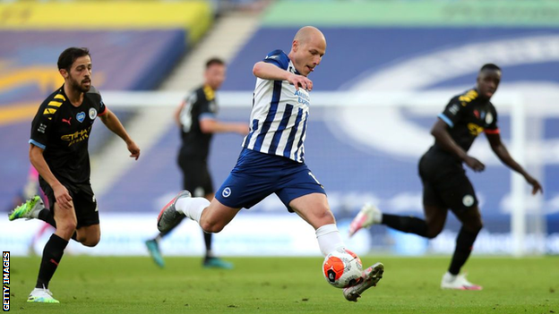 Aaron Mooy playing for Brighton against Manchester City