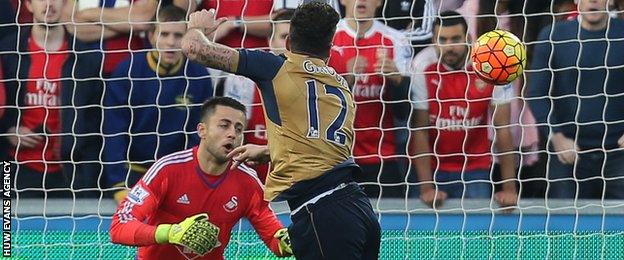 Olivier Giroud's header goes past Lukasz Fabianski