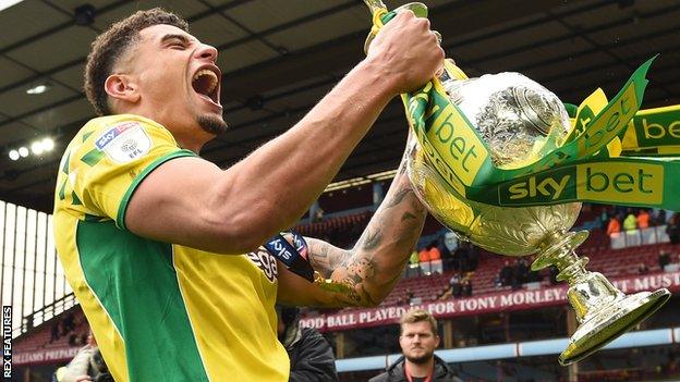 Norwich City defender Ben Godfrey with the Championship trophy