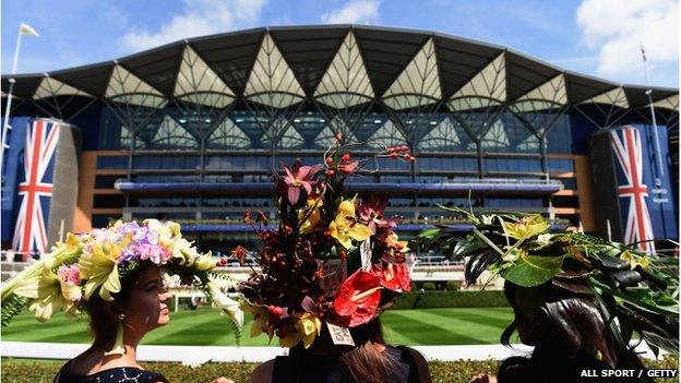 Racegoer"s with flower hats during Day 2 of Royal Ascot 2015 at Ascot Racecourse on June 17, 2015 in Ascot, England