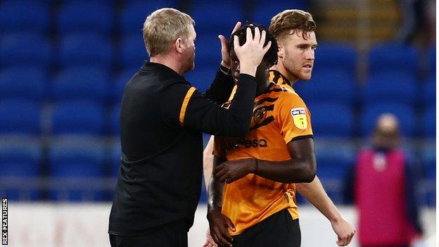 Hull City boss Grant McCann consoles his player after relegation from the Championship