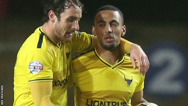 Oxford United celebrate Kemar Roofe's hat-trick against Dagenham