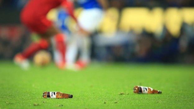 Beer bottles on the pitch at Goodison Park