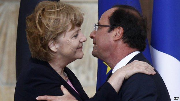 Merkel and Hollande embrace