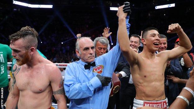 Dennis Hogan (left) shows his disappointment after his controversial world title defeat in April