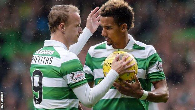 Scott Sinclair takes the ball from Leigh Griffiths