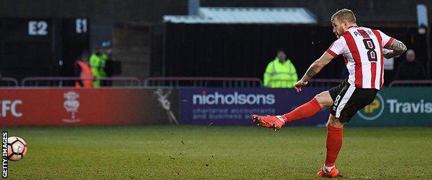 Alan Power scores a penalty