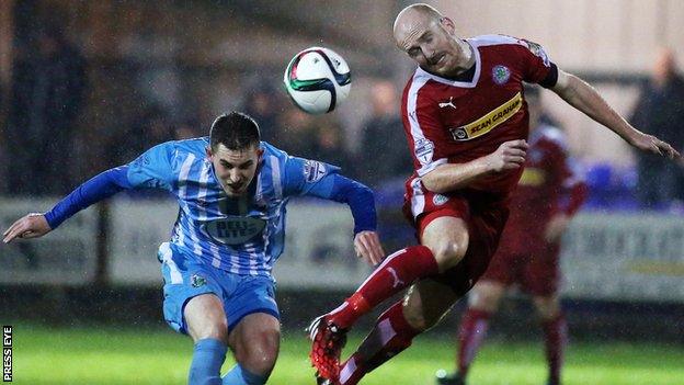 Daniel Hughes battles with Ryan Catney in Tuesday's League Cup semi-final at Milltown