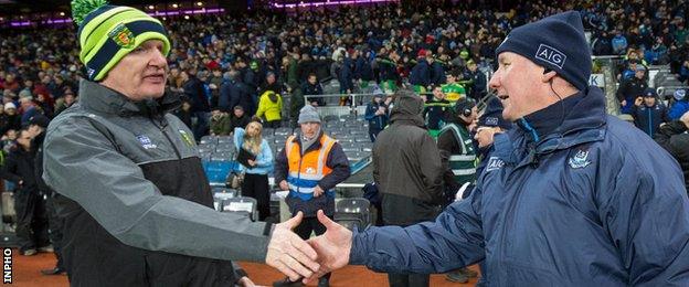 Managers Declan Bonner and Jim Gavin shakes hands after the Croke Park contest