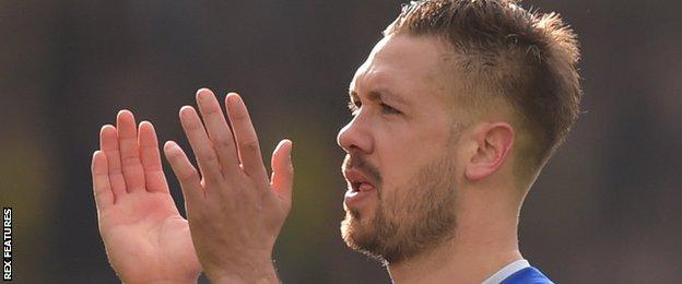 Luke Chambers applauds the Ipswich fans