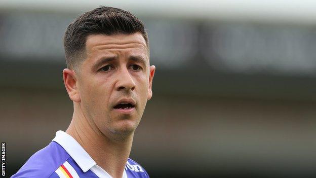 Lloyd James plays for Exeter City against Lincoln City in the first leg of the League Two play-off semi final