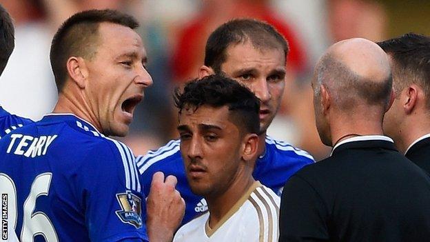 John Terry makes a point during Chelsea's 2015 2-2 draw with Swansea