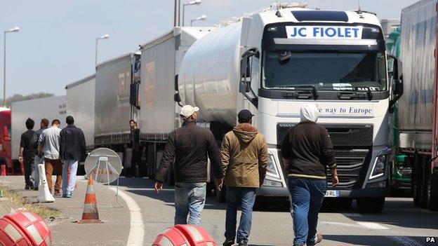 Migrants on the main road into Calais ferry port