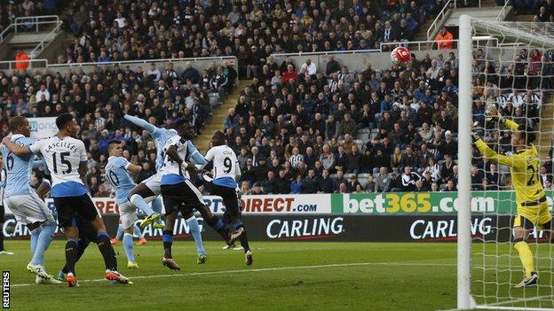 Sergio Aguero heads in for Manchester City at Newcastle