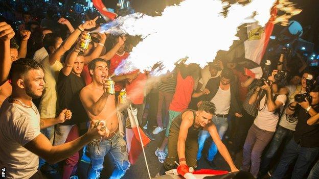 Egyptian fans in Cairo celebrate qualifying for their first World Cup in over a quarter of a century