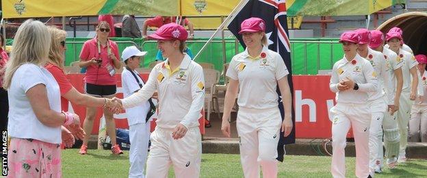 Australia players in pink caps