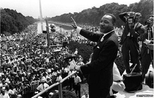 This August 28, 1963 file photo shows US civil rights leader Martin Luther King (C) waving from the steps of the Lincoln Memorial to supporters on the Mall in Washington, DC, during the "March on Washington".