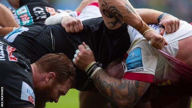 A scrum in a game between Exeter and Harlequins