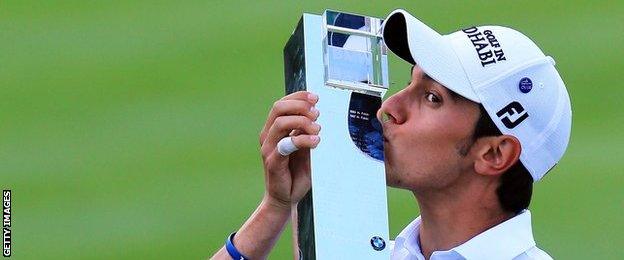 Matteo Manassero kisses the BMW PGA Championship trophy