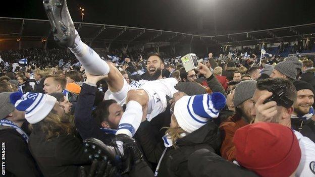 Finland captain Tim Sparv celebrates Euro 2020 qualification with fans