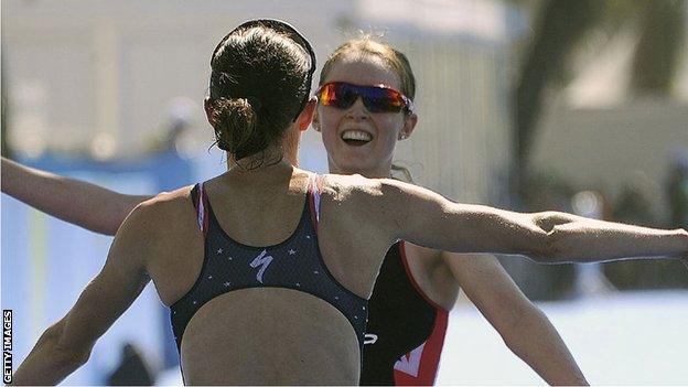 Non Stanford and race winner Gwen Jorgenson embrace after the Rio Olympic test triathlon