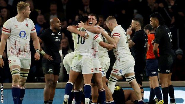 Owen Farrell celebrates with Marcus Smith