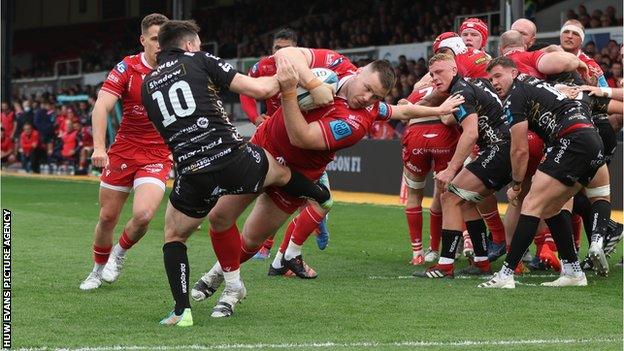 Scarlets prop Rob Evans scores against Dragons in April 2022 in the United Rugby Championship