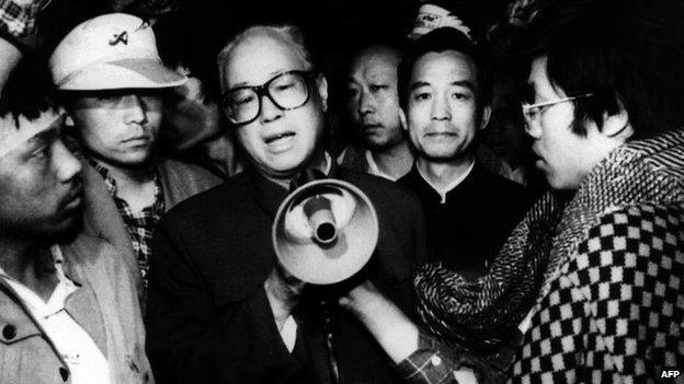 In this 19 May 1989 file photo, Communist Party General Secretary Zhao Ziyang, centre with loud hailer, speaks with fasting university students in Beijing's Tiananmen Square, the last time he was seen in public