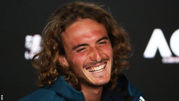 Stefanos Tsitsipas smiles in his news conference